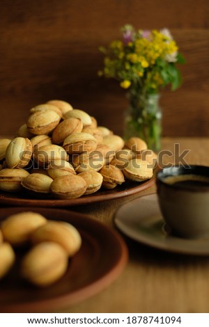 Homemade shortbread nuts with condensed milk and a cup of coffee