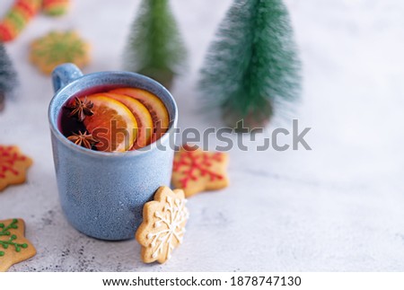 Mulled wine with oranges and anise in a cup. toning. selective focus