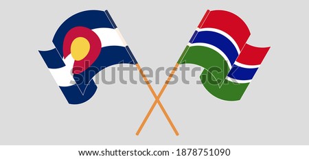 Crossed flags of The State of Colorado and the Gambia