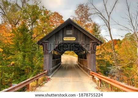 Rural Vermont Covered Bridge by the name of Gold Brook in Stowe, Vermont, USA Royalty-Free Stock Photo #1878755224