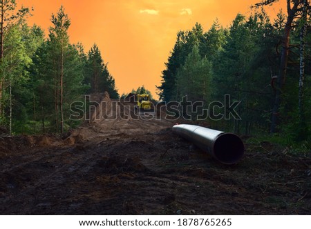 Natural Gas Pipeline Construction. Building of transit petrochemical pipe in forest area. Pipes Welding. Dozer during clearing forest, land clearing, grading, pool excavation, utility trenching
