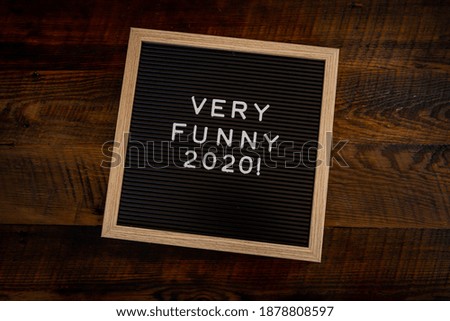 Very Funny 2020 Message Board on Wooden Background
