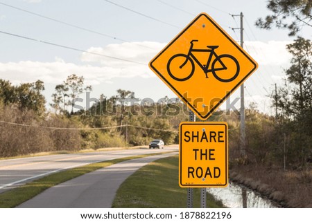 Share the road with bikes (North American road sign)