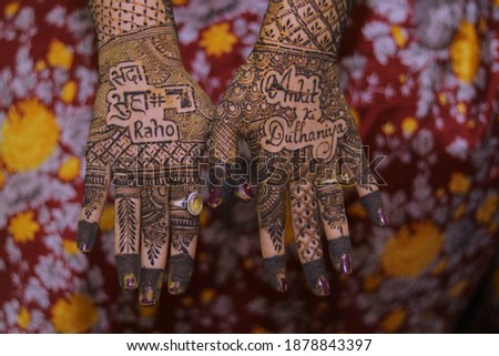 Picture of Bride Mehndi for wedding ceremony. Henna Mehndi on Bride's hand at Indian wedding ceremony. Picture of mehndi hands close up. Beautiful mehndi on Woman's hands. Selective focus concept.