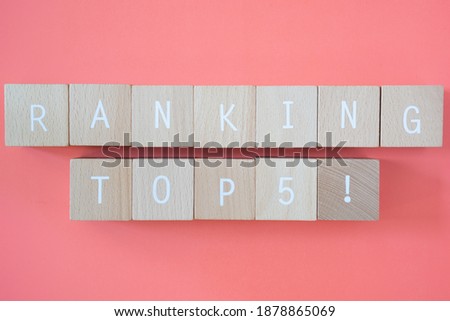 Twelve wooden blocks with ranking top 5 text of concept. Royalty-Free Stock Photo #1878865069