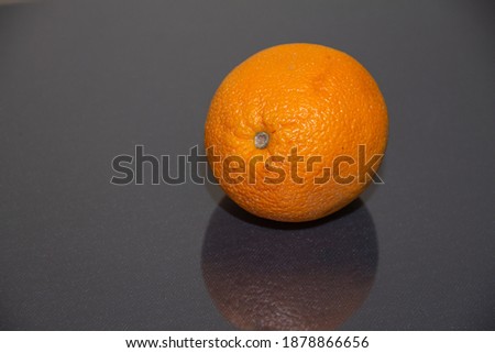 orange lying on a dark background close up