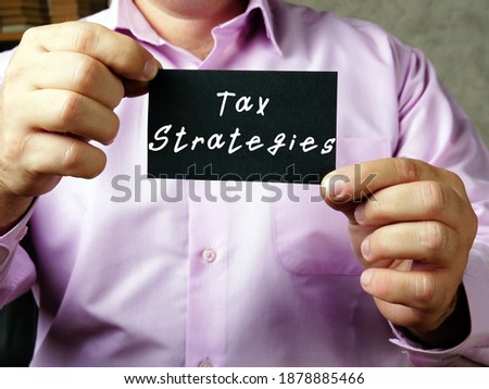 Financial concept meaning Tax Strategies with sign on the sheet.
