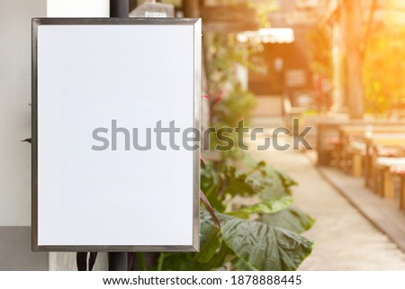 Blank advertising panel on the street. Mock up Menu frame standing in Bar restaurant cafe. space for text. Blank vertical street billboard poster