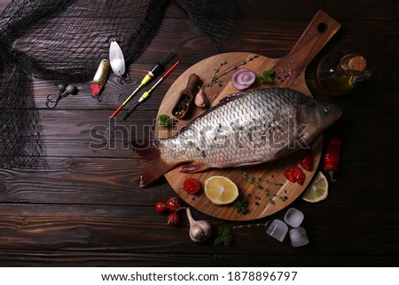 Carp fish with spices and vegetables