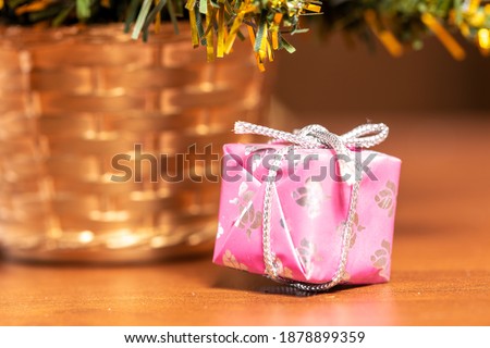 Toys and decorative box on the Christmas tree