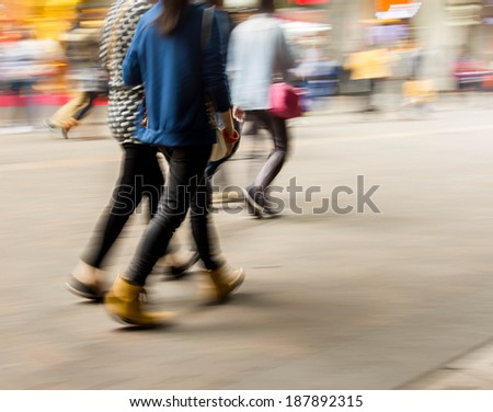 City business people walking in the commercial street, motion blur background 
