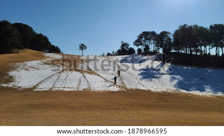 couple at golf course in winter