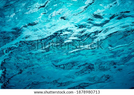 An abstract background of seawater flow under light exposure Royalty-Free Stock Photo #1878980713