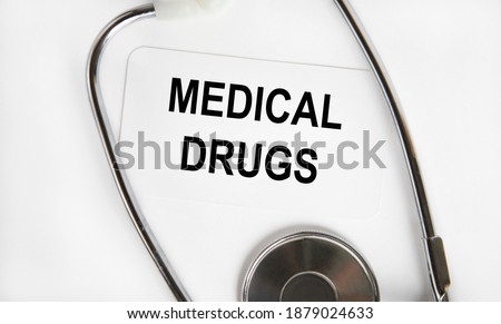 On the card text MEDICAL DRUGS, next to a stethoscope.