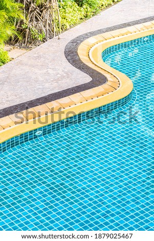 Top of view outdoor swimming pool in resort hotel for leisure relax