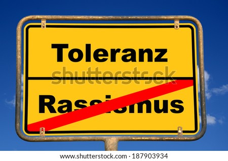 German place-name sign with the German word "Toleranz", translation: tolerance and the crossed out German word "Rassismus", translation: racism