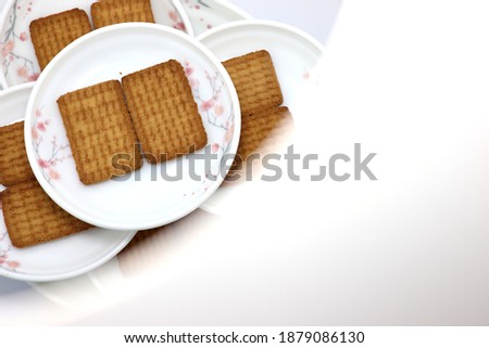 tasty and healthy brown colored biscuit stock on bowl