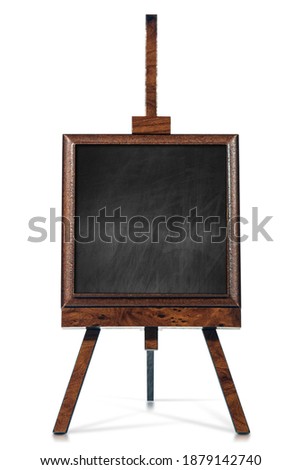 Closeup of a blank chalkboard on a wooden easel, tripod, isolated on white background. Photography with shadows and reflections.