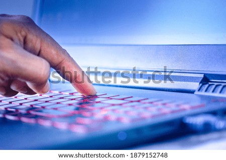 Selective focused on Man's hand and fingers on the keyboard​ of desktop ​computer