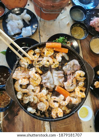 Korean BBQ in Thai Barbecue style, Thailand called "Moo kratha buffet" similar Yakiniku barbecue in japan ,we cooked on hot brass BBQ pan.
 Royalty-Free Stock Photo #1879181707