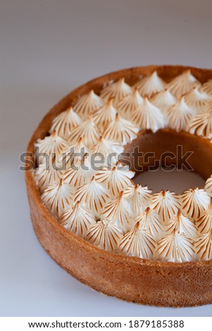 Classy lemon tart with swiss meringue, close up