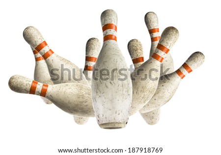 Used vintage bowling pins falling isolated on white