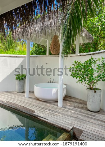 Private pool and bathroom to tropical island villa. Recreation area. Maldives. Vertical image.