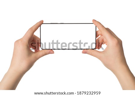 Traveling and making selfie concept. Pov cropped close up photo of female hands holding telephone taking picture isolated white background