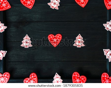 Heart shapers and Christmas tree shapes on wooden background