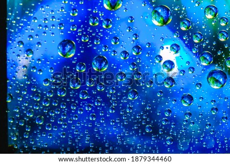 Abstract background about water or space. Multicolored stylish drops. Unusual splashes. It looks like the universe, planets and stars.