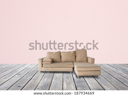 sofa brown on wooden and pink wall paper 