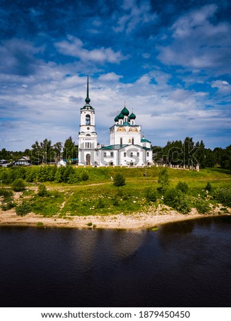 Top view aerial shot of a beautiful landscape with an orthodox c