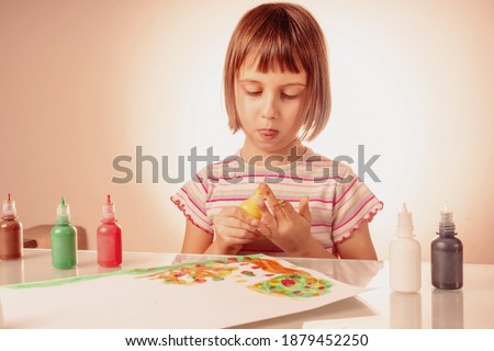 Art and fun leisure time concept. Beautiful young girl great artist painting picture with hands. Horizontal image. 
