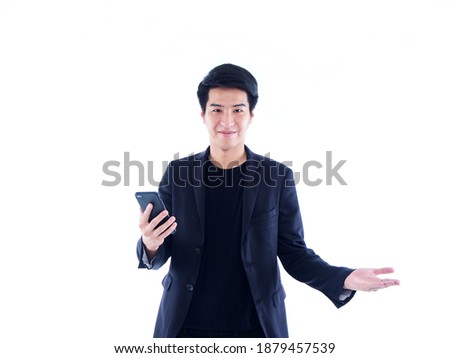Handsome young man with smartphone over white background. Space for text