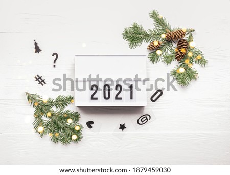 New Year or Christmas layout with numbers 2021. Lightbox with symbols the year