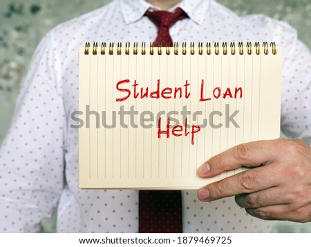 Financial concept meaning Student Loan Help with sign on the sheet.

