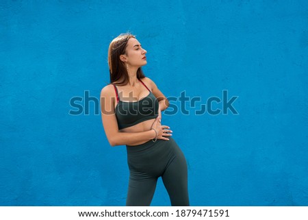 Portrait of a beautiful fitness woman in green sportwear. sport for healthy lifestyle