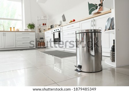 Clean trash bin in modern kitchen Royalty-Free Stock Photo #1879485349