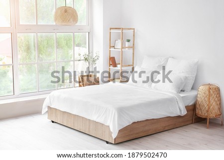 Interior of comfortable modern bedroom Royalty-Free Stock Photo #1879502470