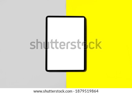 iPad pro with white screen on Illuminating and Ultimate gray color of the year 2021 background Royalty-Free Stock Photo #1879519864