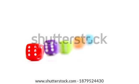 Colored dice on a white background. Selective focus.
