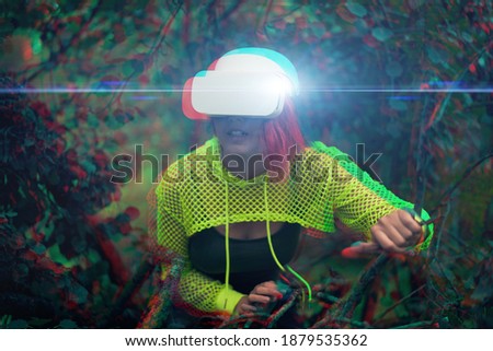 Woman goes into virtual reality using virtual reality headset. Image with glitch effect. The concept of virtual reality, simulations, games and technologies of the future.