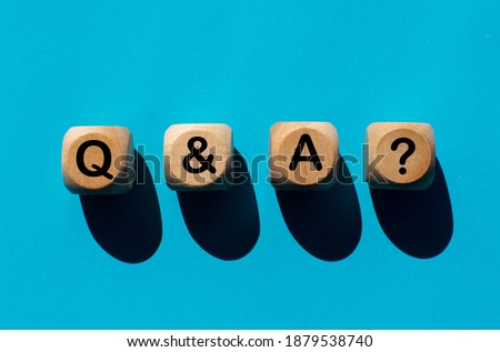 Letter q and a, question mark on wooden ball, turquoise background