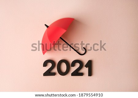 New Year 2021 with red umbrella on pink background