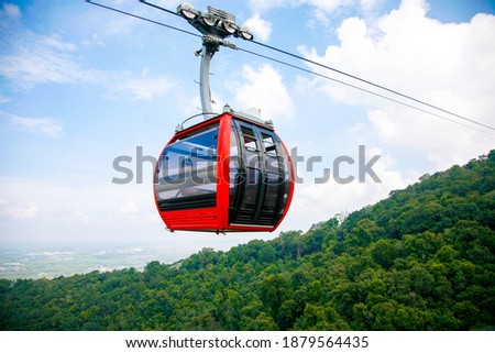 Cable car trip to viewpoints in the mountains. During the trip by cable car Tourists enjoy beautiful views and experience exciting. Royalty-Free Stock Photo #1879564435