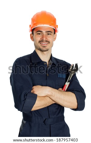 young worker standing with spanner isolated on white background