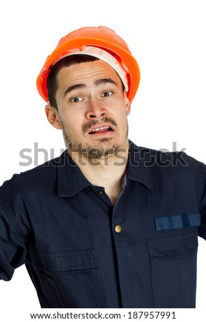 Funny worker in helmet with emotion on her face on white background