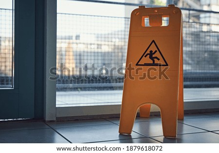 Yellow wet floor warning sign
