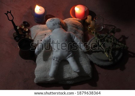 Curses are made from voodoo dolls and materials for curses. This picture is used to compose an article about the voodoo magic ritual.