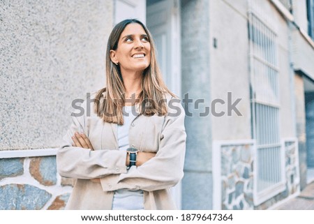 Young caucasian woman smiling happy walking at the city.